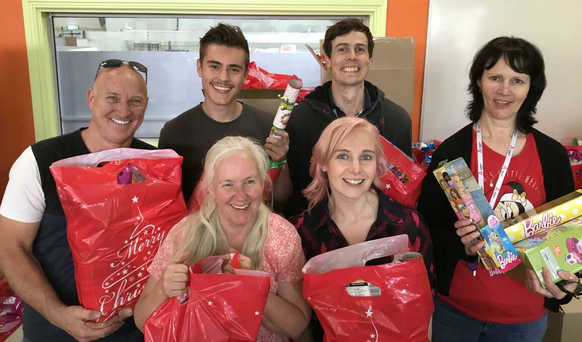 Help: 3BA's PT, Power FM's Xander, Kris and Jules with Anglicare's community development officer Kim Boyd and emergency relief coordinator Pauline Prebble. 
