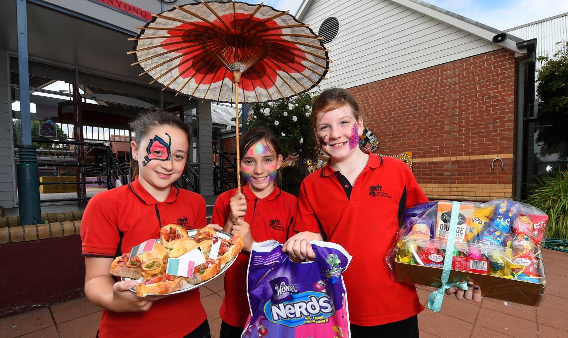Tempting fete: Buninyong Primary School students Astrid Forsyth, 11, Zahra Taylor, 11, and Imogen Beck, 10 prepare for Friday's celebrations. Picture: Adam Trafford