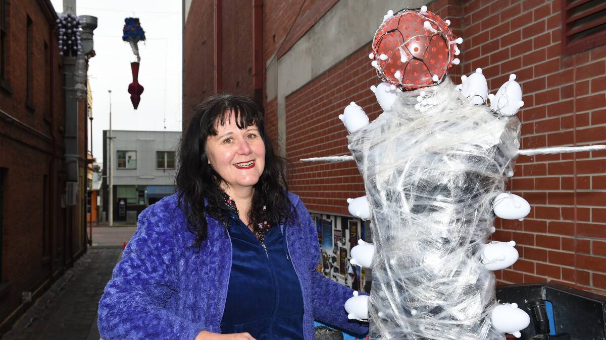 Sound and vision: Melinda Muscat, the curator of the 'Music Heard Visually' exhibition, pictured during the Laneway Lumieres event. Picture: Kate Healy