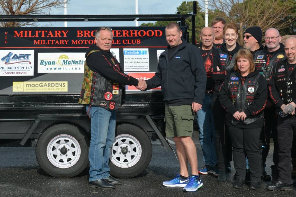 Helping hand: MCMMC VIC West sub-branch president Greg Green with Paul Brisbane from Trade Link, who supplied the barbecue trailer's gas fittings, and other sub-branch members. Picture: Supplied