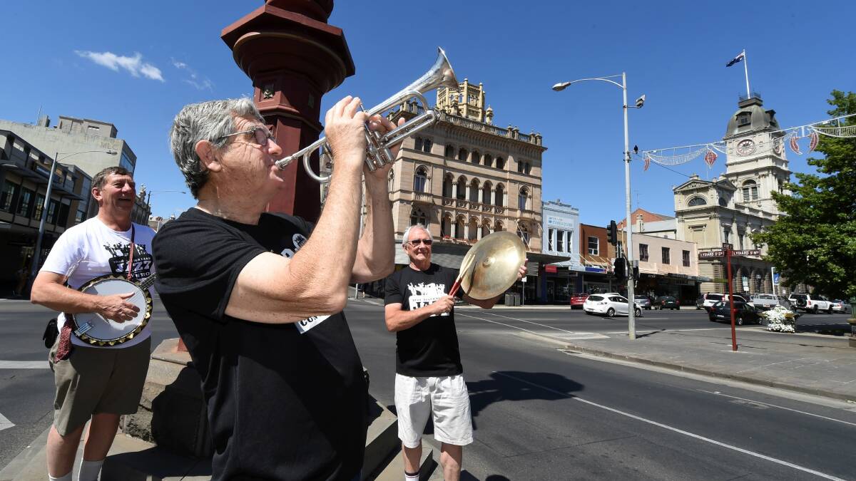 Big noise: Musicians Reg Packer, Ken Hill and Rod Andrew get into formation for the Australian Jazz Convention, which started yesterday. Picture: Lachlan Bence