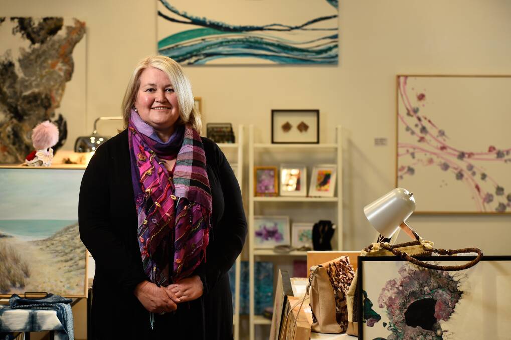 Stroke of luck: Artist Kate Wise poses for a photo in her Block Arcade retail space, which is part of the Ballarat Evolve program. The organisation has applied to City of Ballarat for a grant at Wednesday night's council meeting. Picture: Adam Trafford