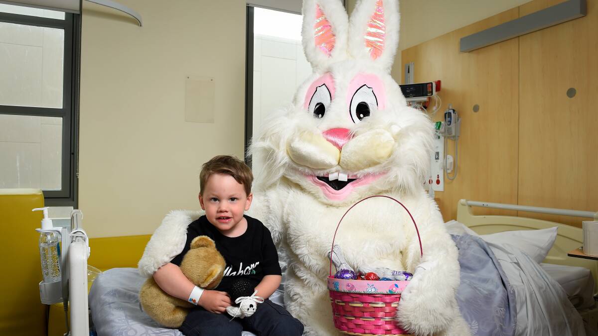Lucas Cornell poses for a photo with the Easter Bunny during a Lions Club Ballarat visit to Ballarat Health Services. Picture: Adam Trafford