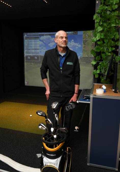 In the swing: Drummond Golf Ballarat's Chris McIntosh with the store's new golf simulators. Picture: Lachlan Bence