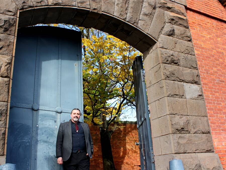 History revealed: Dr David Waldron from Federation University stands outside the gate of the Ballarat Gaol, which now makes up part of the university's Lydiard Street campus. Virtual tours of the gaol will be available as part of Ballarat Heritage Weekend.