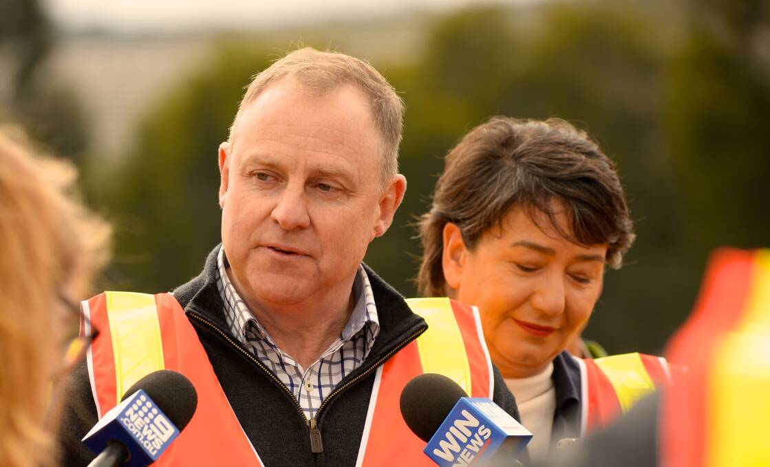 On the road again: New Regional Roads Victoria chief officer Paul Northey on the launch of the new government department, flanked by Labor candidate for Buninyong Michaela Settle. Picture: Supplied