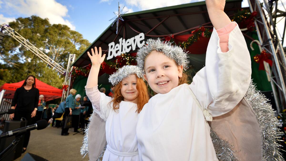 Angelic: Four-year-old Charlotte Keays, and four-year-old Skylar Eaton get into the festive spirit at the 2017 Buninyong Community Carols held at De Soza Park on Saturday. Picture: Dylan Burns
