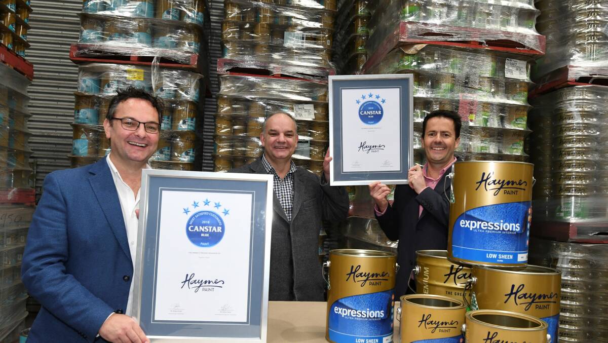 Haymes Paint's Tim Haymes, Matthew Haymes, and company CEO Rodney Walton. Picture: Lachlan Bence