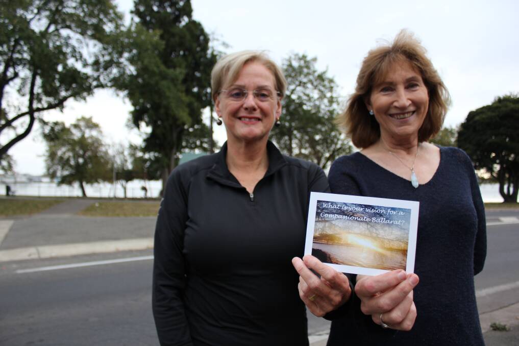 Care on the cards: Federation University researchers Dr Mary Hollick and Dr Lynne Reeder hold a postcard, which will prompt Ballarat residents to consider how to make Ballarat more compassionate. Picture: Ashleigh McMillan