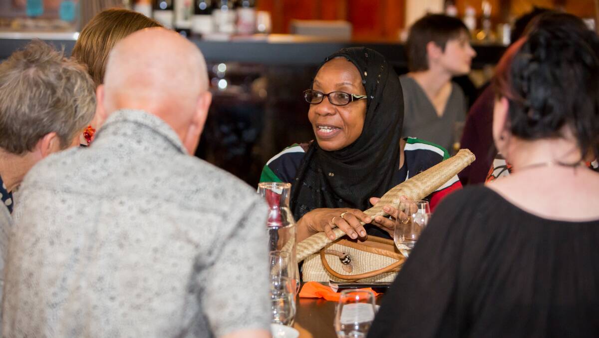 Cultural exchange: Joy Juma, who came to Australia in 2004 from Kenya, at the It Takes Courage dinner event in December. The dinner raised funds for a cookbook to be released this year. Picture: Michelle Dunn Photography