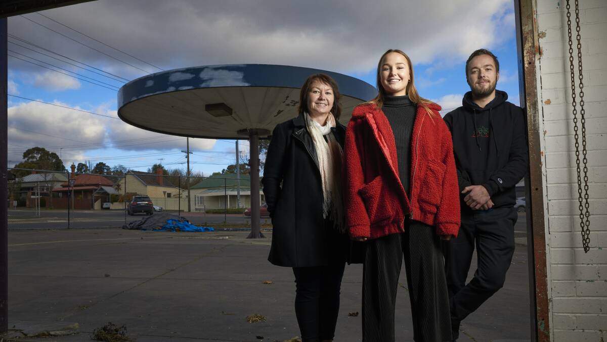 Drive to succeed: Sam Fraser, Ruby Staley and Jarrah Staley at the former petrol station on the corner of Grant and Barkly streets, which they plan to transform into a cafe. Picture: Luka Kauzlaric