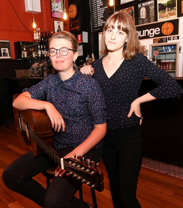 Ladies night: Ballarat musicians Rhiannon Simpson and Ari Lane tune up for the Gig For Good on Saturday at Karova Lounge. Picture: Lachlan Bence