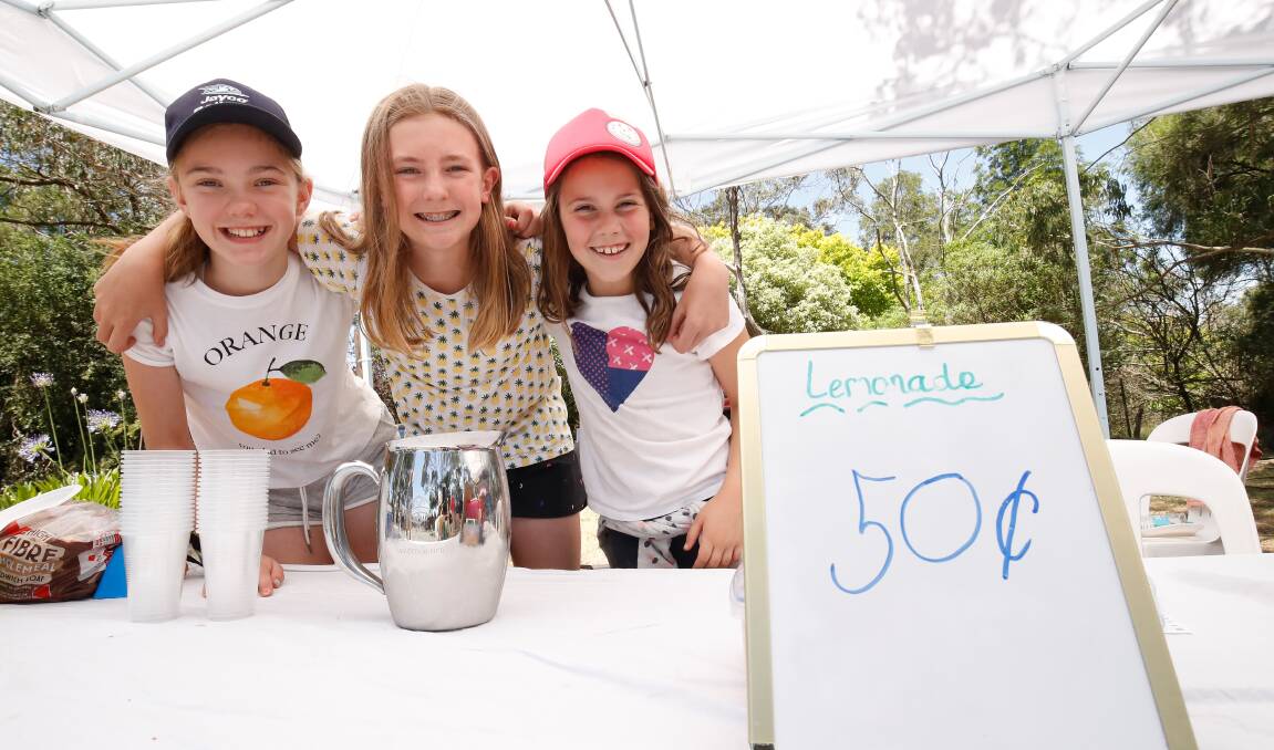 When life gives you lemons: Grace Quigley, 11, Isabella Pearce, 12, and Sophie Sneyd, 9, pose  in their homemade lemonade. Picture: Adam Trafford