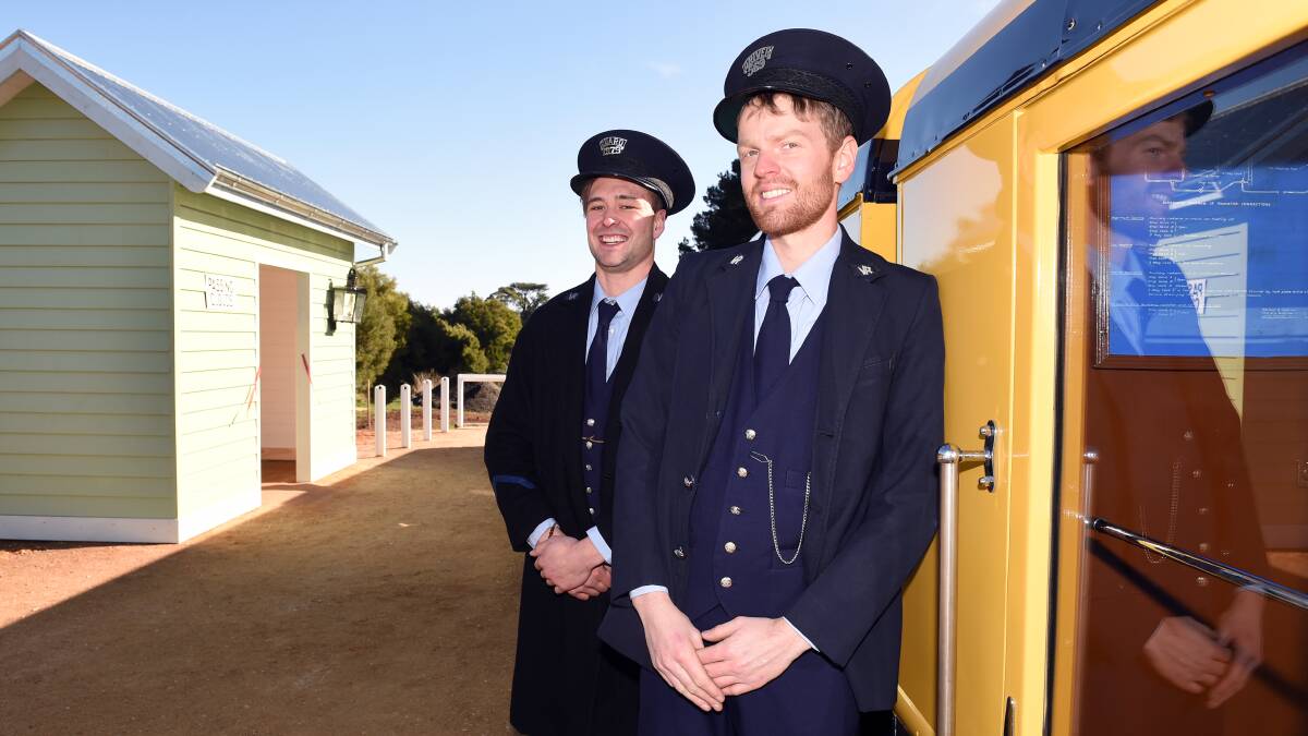 All aboard: Conductors Liam Deppeler and Steven Fiume stand on the new Spa Country Railway platform at Passing Cloud Winery, the first of its kind in Australia. Picture: Kate Healy