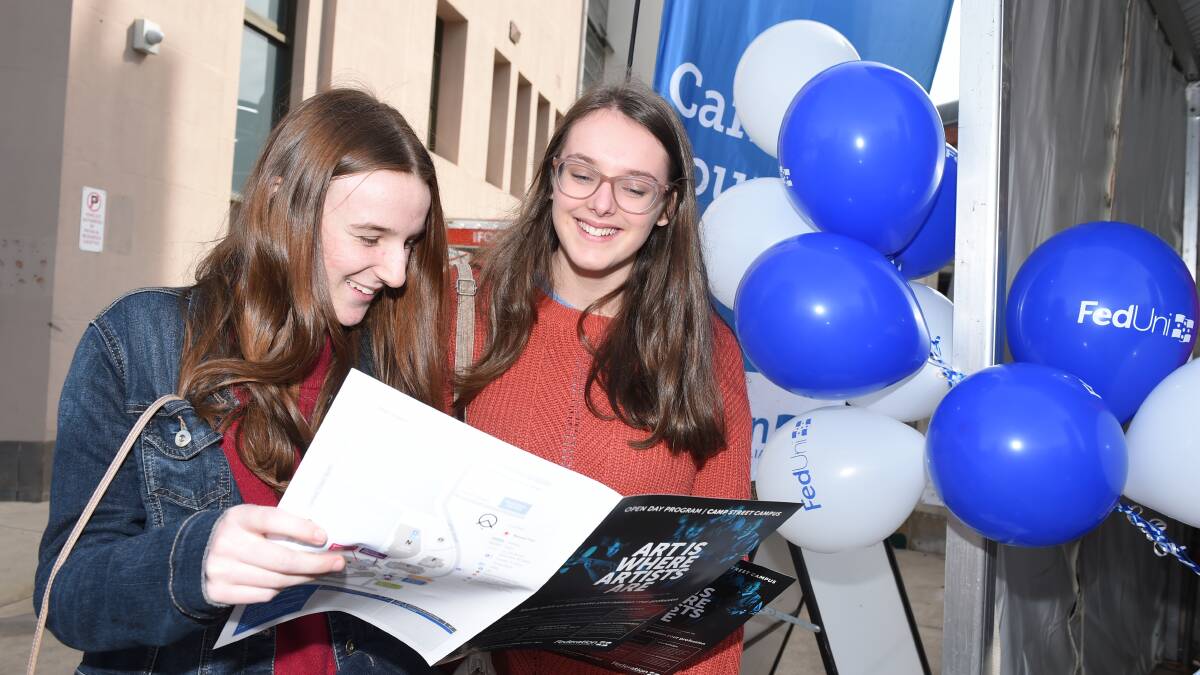 Big choice: Madeleine Kelly and Alice Stinchcombe, both from the Mornington Peninsula, check out their options at the Federation University open day on Sunday. Picture: Kate Healy