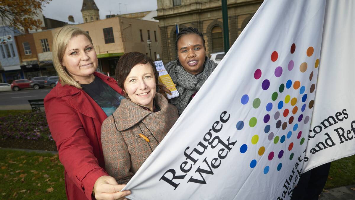 Wadawurrung traditional owner Bonnie Chew, Councillor Belinda Coates and settlement services development officer Deruka Dekuek at the flag raising ceremony as part of Refugee Week 2018. Picture: Luka Kauzlaric