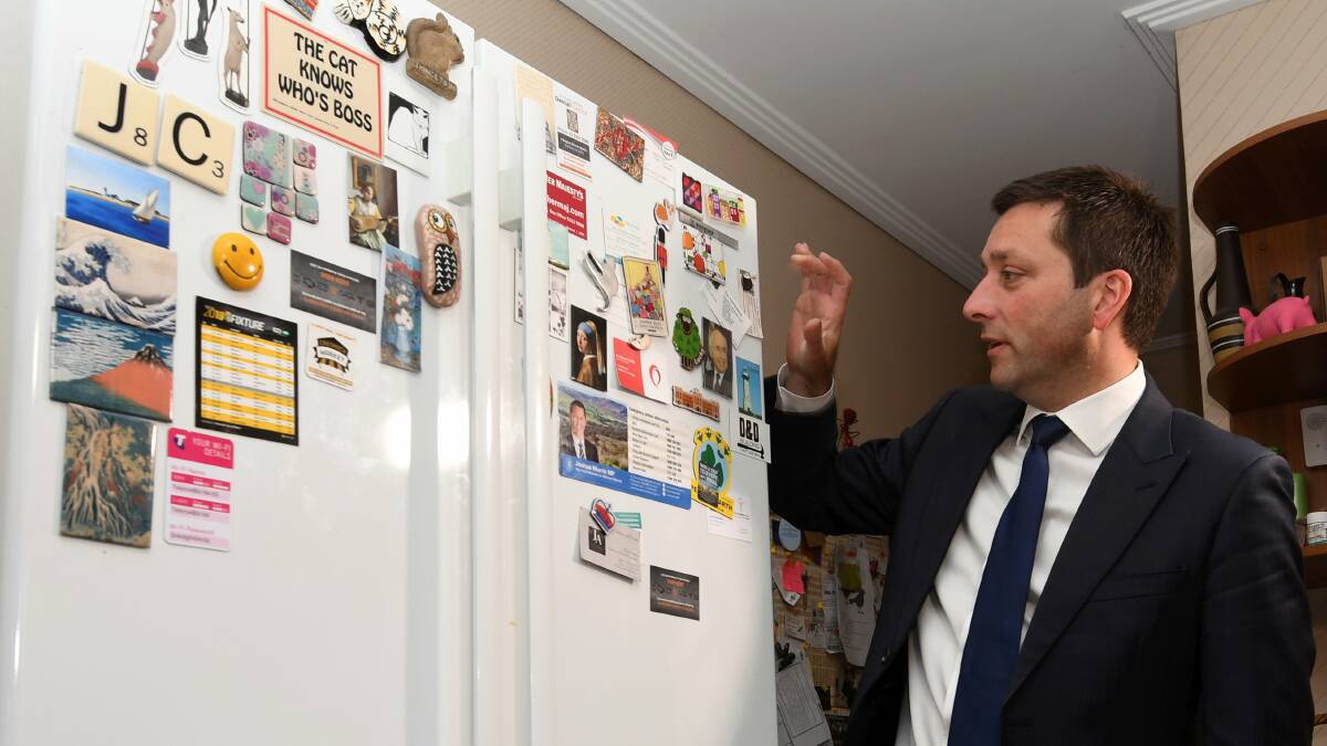 Matthew Guy surveys an ageing fridge in Joyce and Arnie Curry's house in Wendouree on Friday. Picture: Lachlan Bence