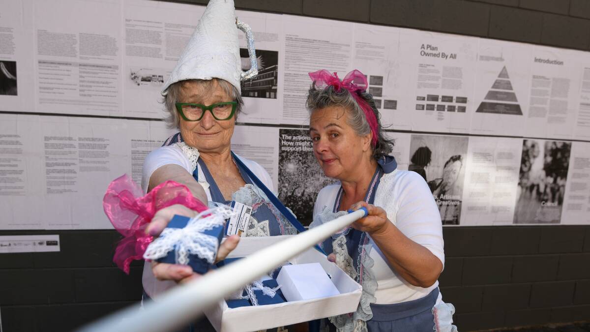 All tied up: Ballarat artists Heather Horrocks and Marg Dobson are offering up their 'soapbox' to local creatives on the Creative City Strategy, which has been pasted up in Police Lane for easier consumption. Picture: Lachlan Bence