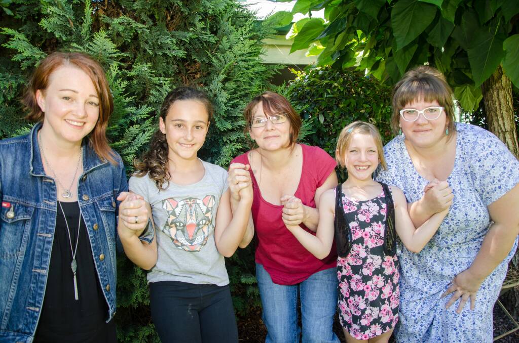 Unbroken: Reclaim The Night organisers and their daughters, Catherine Farrah, Isabelle, 10, Kate Poynter, Niamh, 7, and Siobhan Fearon pictured earlier this year standing against gender-based discrimination.