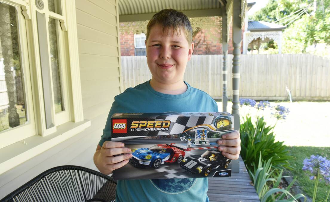THANKS: Riley Magner with a Lego set donated after his family's house was gutted by fire earlier this week. Picture: Jeremy Bannister