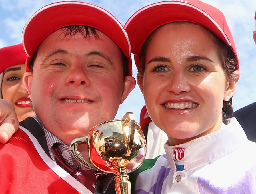 WINNING FEELING: Ballarat jockey Michelle Payne and her strapper brother Stevie with the 2015 Melbourne Cup she won while riding Prince of Penzance, trained by Ballarat-based trainer Darren Weir.