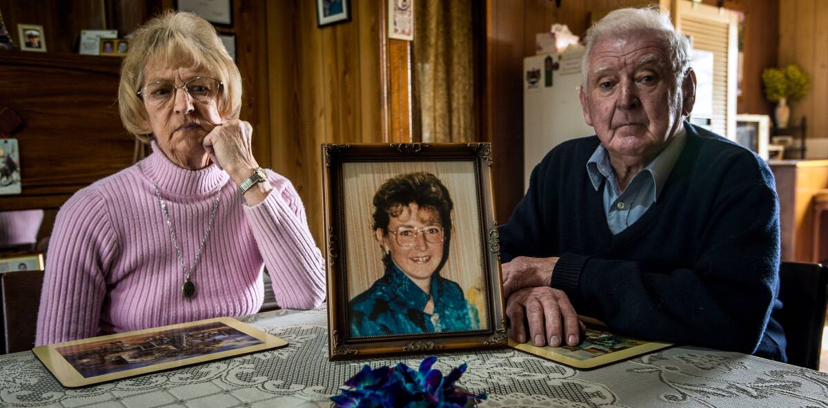 HEARTBREAK: Spike and Ann Jones with a photograph of their daughter Nina Nicholson, who was murdered at Clunes. Picture: Justin McManus