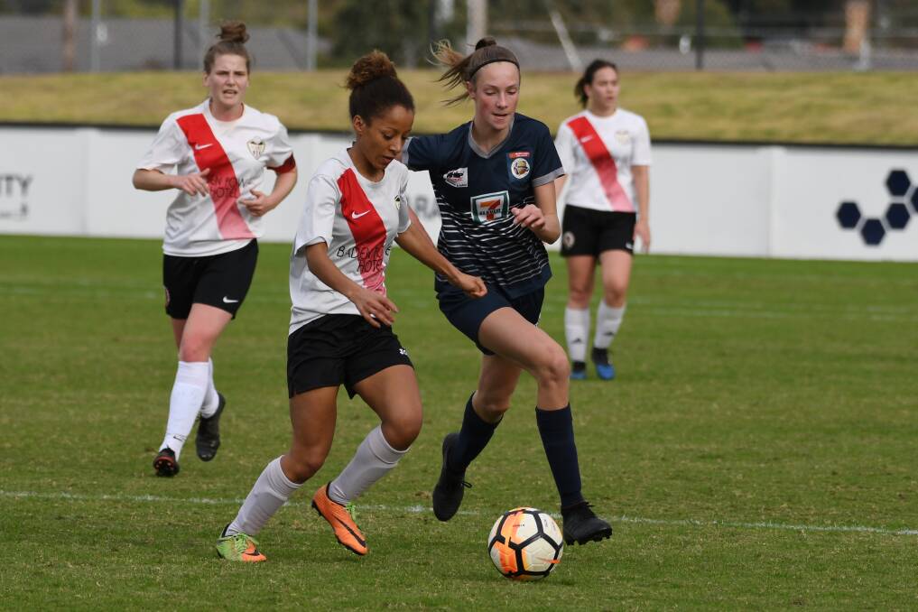 BATTLE: Ballarat City's Chloe Stevens fights for the ball. Picture: Kate Healy.