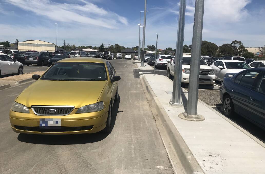 RIDICULOUS: A commuter blocks off an entire driving lane rather than parking in the new spaces at Wendouree Station. 