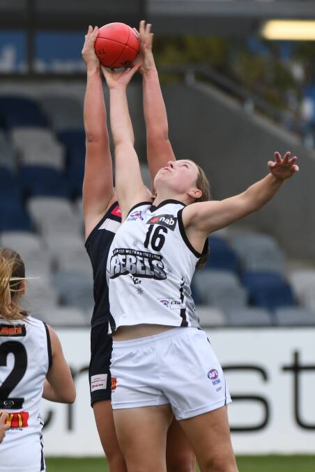 REBELS: Lauren Sykes skies for the ball. Picture: Kate Healy