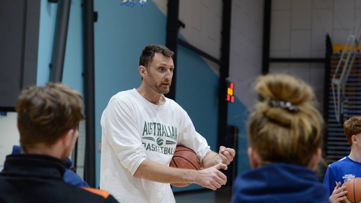 HIGH REGARD: Australian basketball legend Chris Anstey in Ballarat assisting the SEDA program. Picture: Kate Healy. 