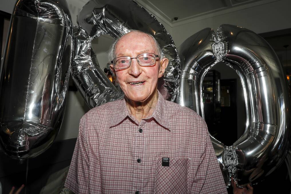 ALL SMILES: Celebrating his 100th birthday, Gerard O'Loughlin grins from ear-to-ear surrounded by family and friends. Picture: Dylan Burns