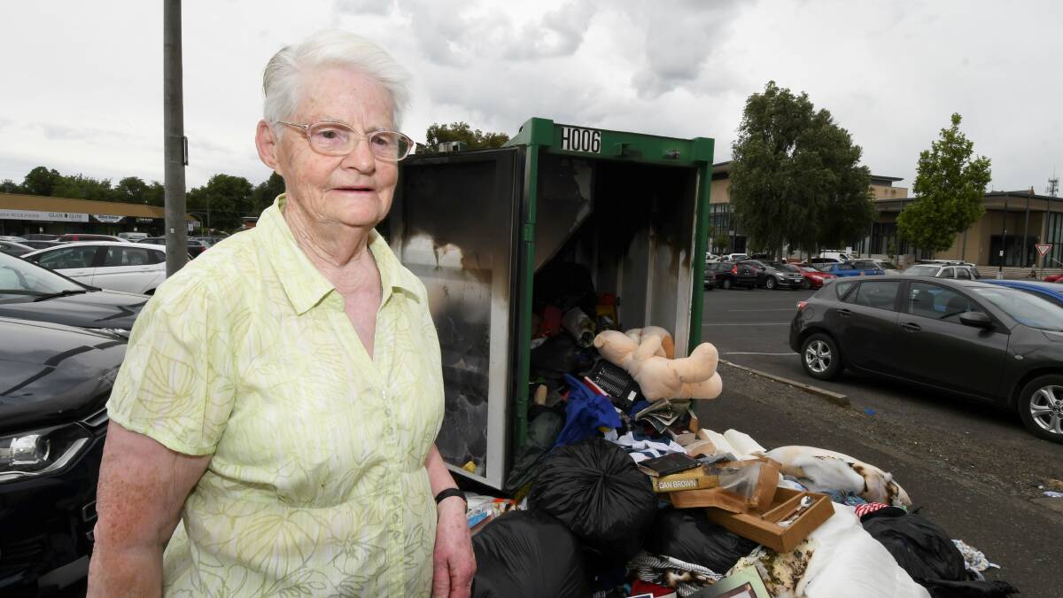 BURNOUT: Bev Medley in front of the mess of donations expelled from the Wozzles charity bin. Picture: Lachlan Bence