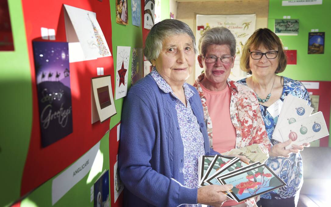 CHEER: Connie Sadler, Judy Morrison and Denise Boyko at the Combined Charities Christmas Card Shop. Picture: Luka Kauzlaric.