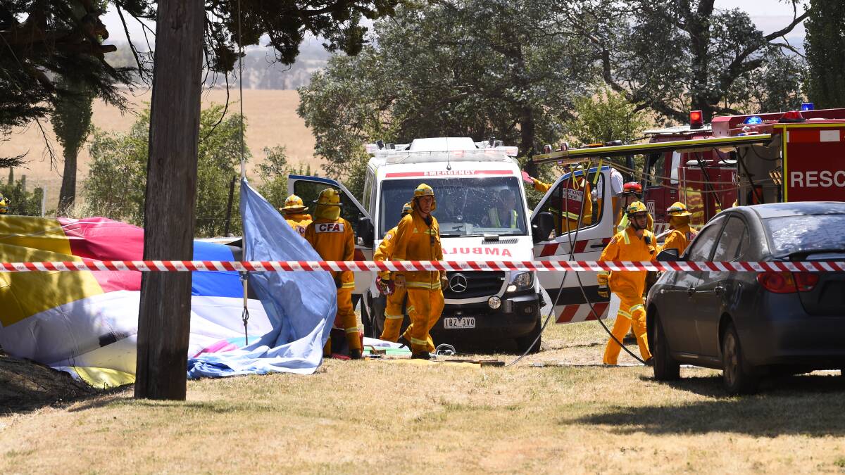 TRAUMA: CFA members helping cover the carnage after the December collision. Picture: Adam Trafford.