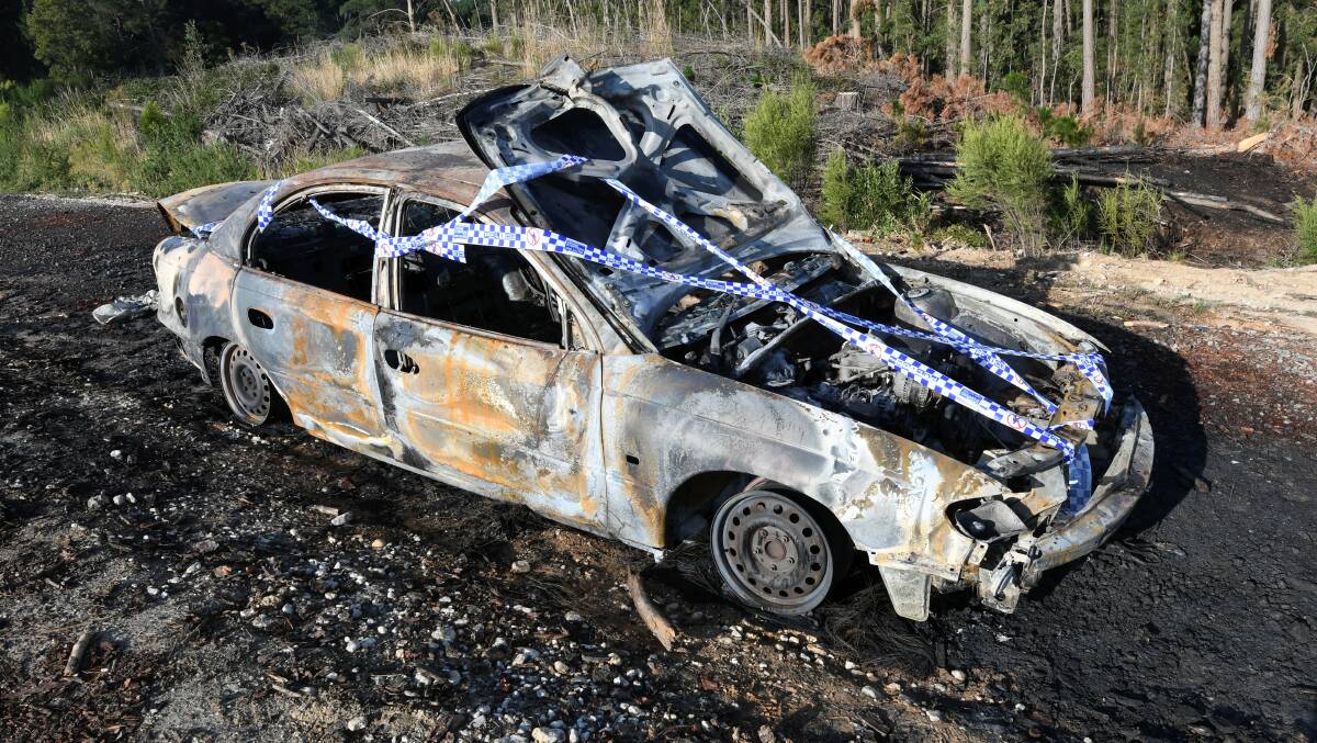 The burnt-out car on Frenchmans Lane. Picture: Lachlan Bence