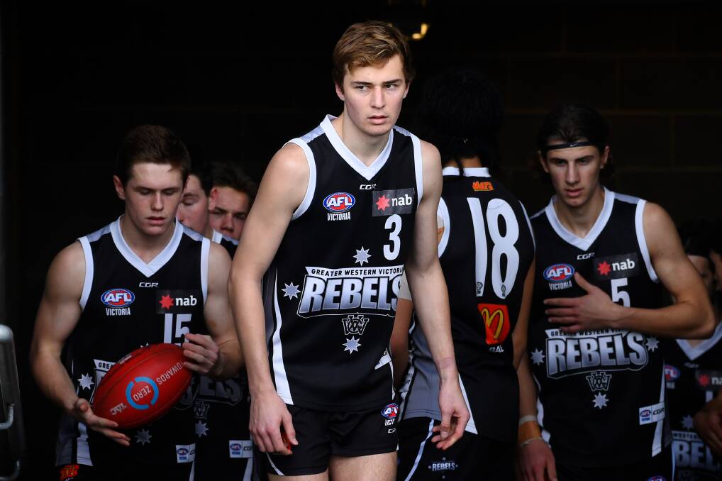 JUST SHORT: Toby Mahony leads the Rebels out onto Mars Stadium. Picture: Adam Trafford