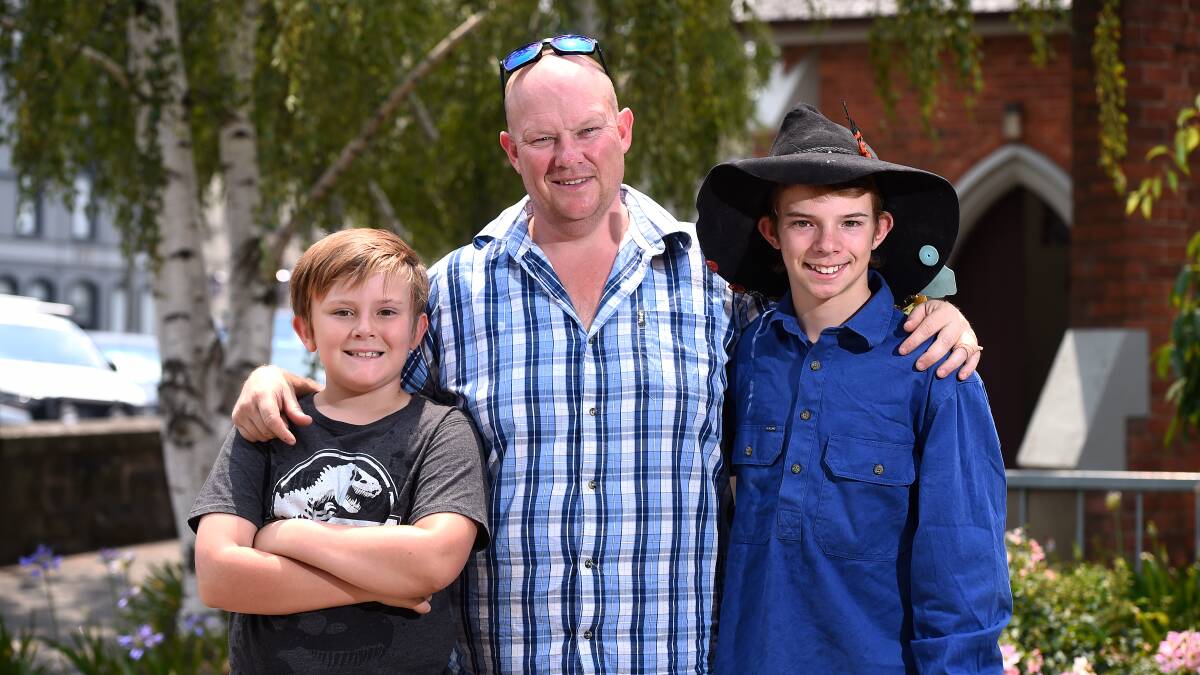 DONATIONS: Kelly Dubberley, middle, with his two sons Tyrone, right, and Nathan, left, after returning back to Ballarat from Mallacoota. Picture: Adam Trafford.