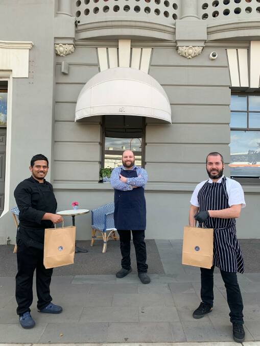 ON ITS WAY: Provicial Hotel kitchen staff Heshan Perera (left), Flavio Argenio (centre) and Mauro Lacone. Picture: Supplied. 