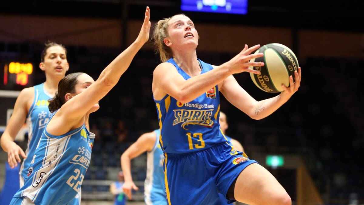 DRIVE: Abigail Wehrung drives to the basket in her career-high 30-point performance against the Canberra Captials last season. Picture: Glenn Daniels.