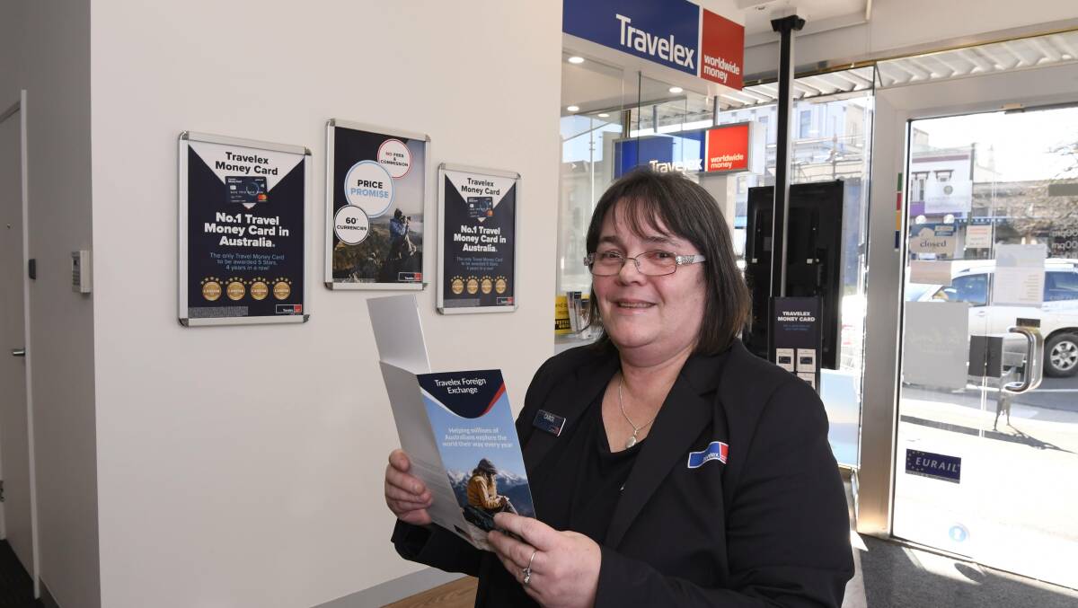 HIP HIP: Travelex store leader Carol Tilley said the store needs support for its birthday present. Picture: Lachlan Bence.