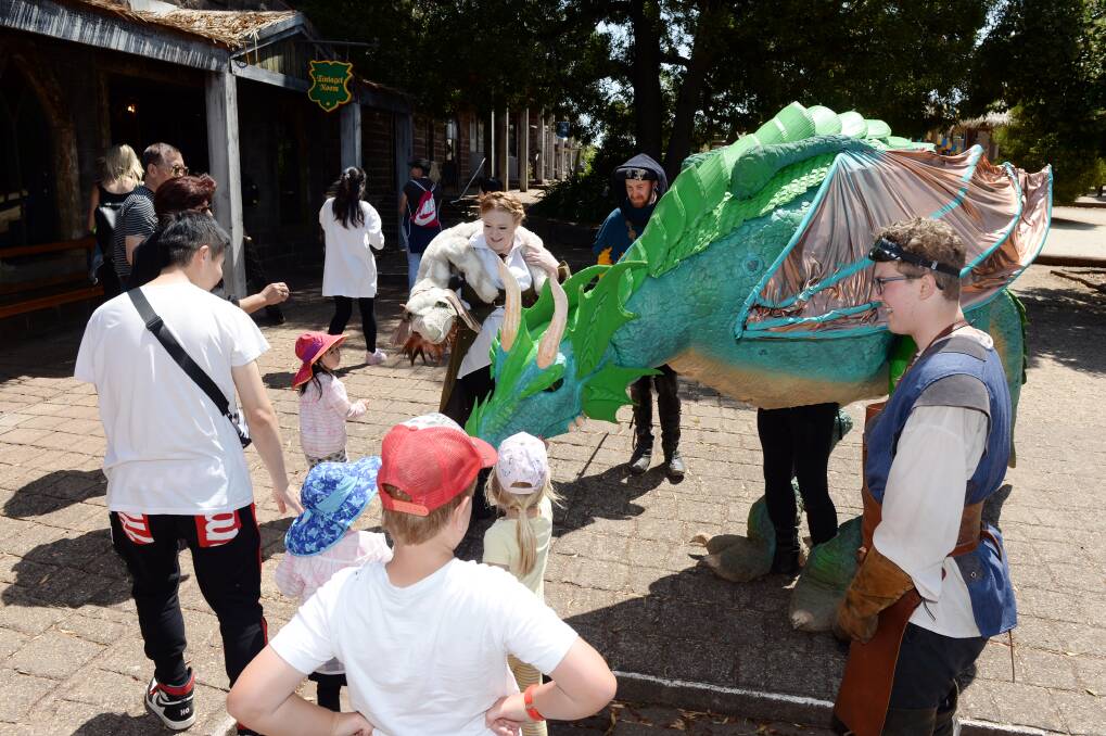 ON SHOW: Crowds gather around Kryal Castle's new dragons, which have been roaming the grounds over the school holidays. Picture: Kate Healy.