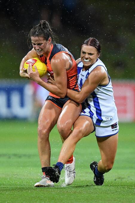 EFFORT: Nicola Barr of the Giants is tackled by Jenna Bruton of the Kangaroos. Picture: Dan Himbrechts.