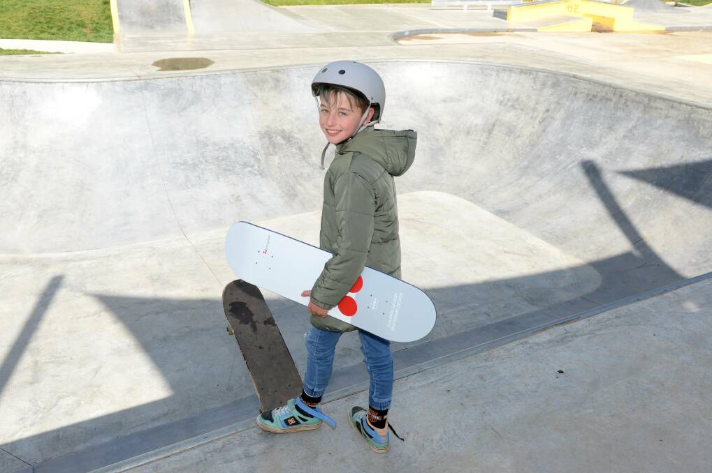 DROP IN: Daylesford skateboarder Mason Misso holding his new board he was gifted by a stranger at the weekend. Picture: Kate Healy.