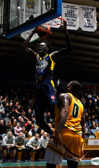 SLAM: Deng Acuoth used his length and athleticism to frequently finish above the rim. Picture: Adam Trafford. 