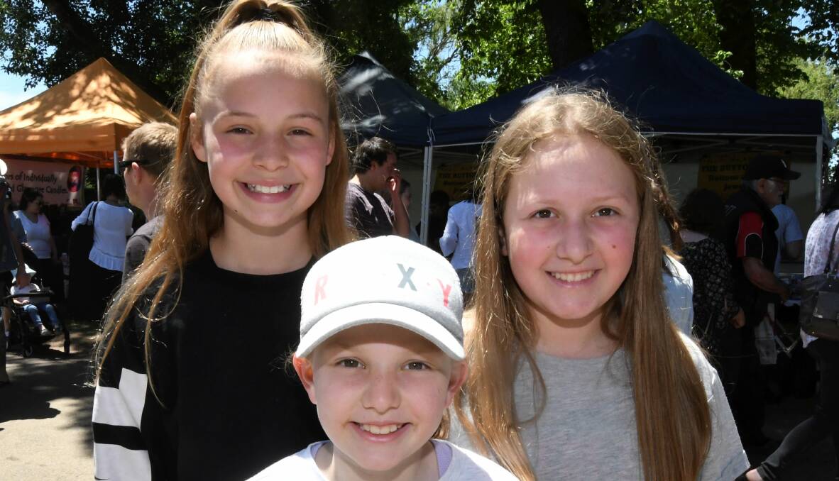 FUN FOR ALL: Bella Benn 11, Belle Jones 9 and Sophie Jones 11 enjoying Springfest at the weekend. Picture: Lachlan Bence.