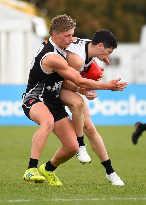 TACKLE: The Rebels' Jay Rantall (left) was once again among the best in their NAB League loss to the Northern Knights. Picture: Adam Trafford.