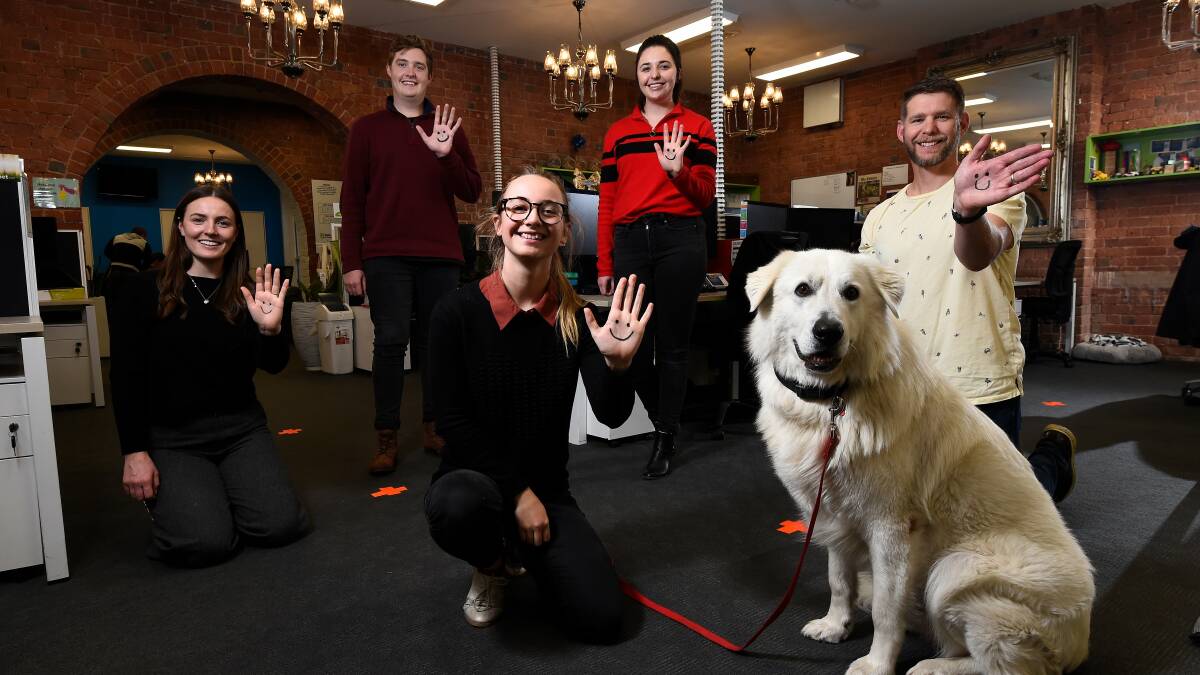 GIVE A SMILE: PETstock head office staff show their gratitude for volunteers. Picture: Adam Trafford.
