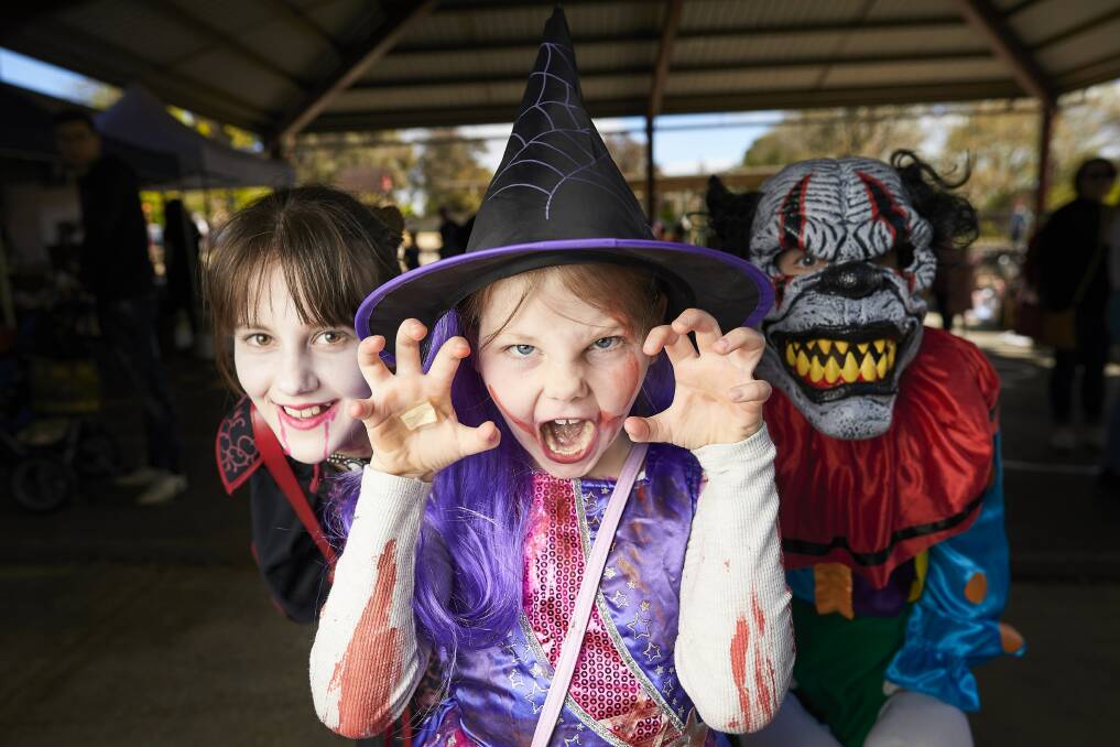 SCARE: Lola, 11, Emily, 7 and Caden, 9, during Macarthur Street Primary Schools Halloween fair. Picture: Luka Kauzlaric.