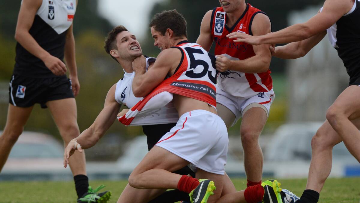 BATTLE: Dan Nicholson (right) playing against the North Ballarat Roosters in the VFL in 2013. Picture: Adam Trafford