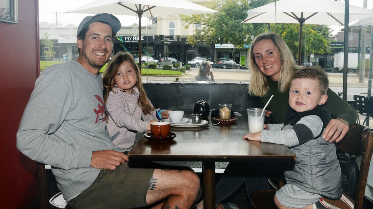 SUPPORT LOCAL: Bradd and Danni Wilson enjoy a quick coffee with their kids at L'espresso on Sturt Street. Picture: Kate Healy.